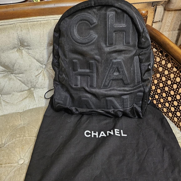 CHANEL Handbags - Authentic unused Chanel Black nylon mesh embossed backpack
